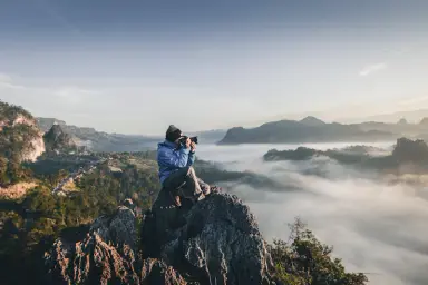 Photographer overlooking a mountain landscape